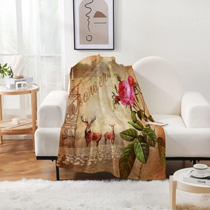 Cozy flannel blanket with retro floral elk print draped over a stylish fabric sofa