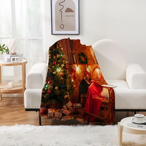 Detailed view of thick flannel blanket with festive Christmas tree and fireplace print