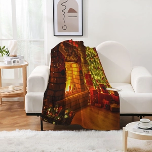 Detail of flannel blanket featuring a warm Christmas fireplace and tree digital print