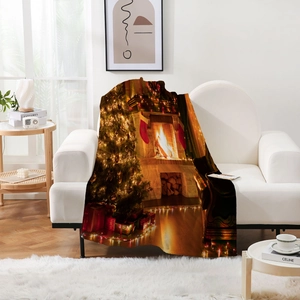 Detail of soft flannel blanket with festive Christmas tree and fireplace digital print