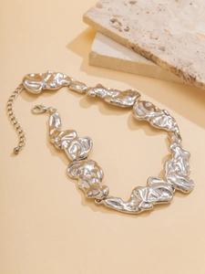 Detailed close-up of liquid lava texture choker necklace with lobster clasp and chain