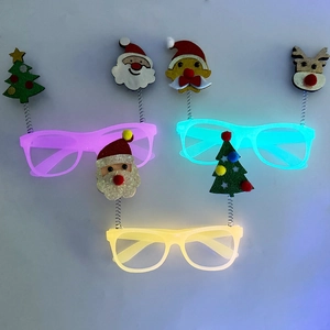 Detailed view of LED light-up Christmas glasses with spring-mounted festive characters