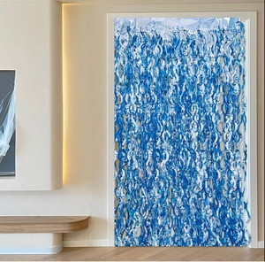 Detailed close-up of blue laser wavy fringe curtain for birthday party background decor