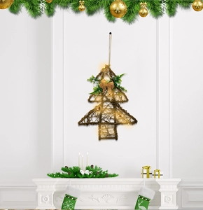 Detail of rustic star-shaped grapevine Christmas tree with warm LED lights and burlap bow