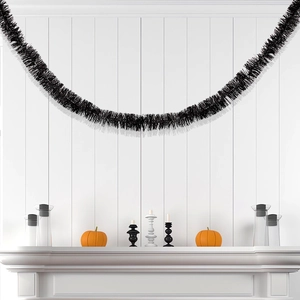 2m fluffy black tinsel garland draped on wall for minimalist Halloween party decoration