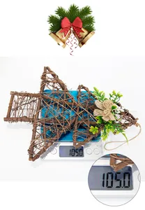 Detail of wooden star ornament weighing 105g on a scale for Christmas tree decoration