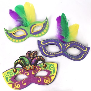 Detailed flat lay of three carnival masks with glitter finish and vibrant feathers