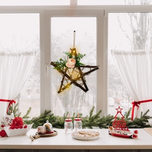 Handmade rustic star wreath with warm LED lights and pink rose for holiday wall decor
