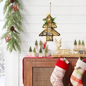 Hanging rattan Christmas tree with warm LED lights, red berries and a burlap bow