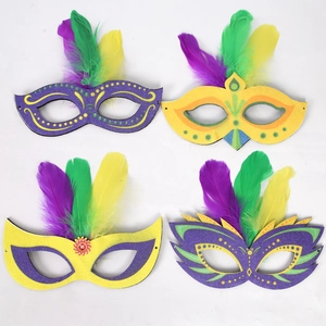 Set of four Mardi Gras feather masks in classic purple green and gold party colors