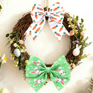 Close-up of Easter ribbons with bunny and carrot prints styled on a woven wreath