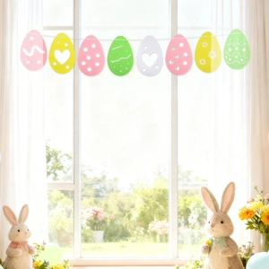 Colorful Easter egg felt banner with heart cutouts hung by a window for party decor