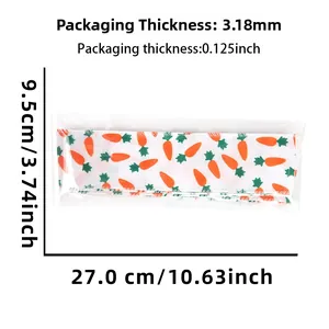 Detailed view of carrot print ribbon dimensions showing 27cm length and 9.5cm width