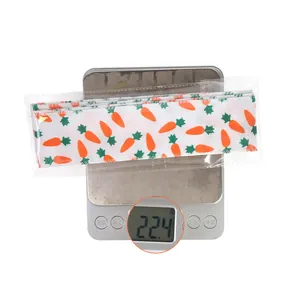 Detail showing 22.4g weight of carrot print Easter ribbon on a digital scale