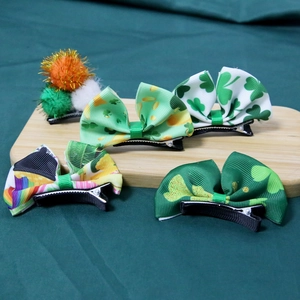 5-piece St. Patrick's Day hair clip set with clover bows and Irish pom-poms on wood