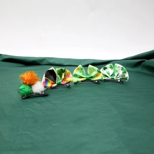 Detailed set of St. Patrick's Day hair clips with shamrocks and colorful ribbons