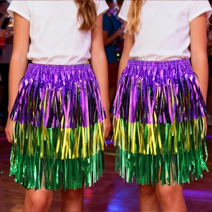 Detail of purple, gold, and green fringe layers on a festive carnival hula party skirt