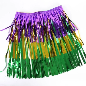 Close-up of three-tier purple gold and green metallic fringe skirt for festive parties
