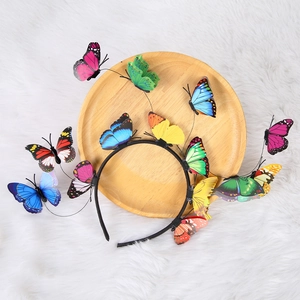 Detailed view of colorful 3D butterfly headband on a soft white faux fur texture
