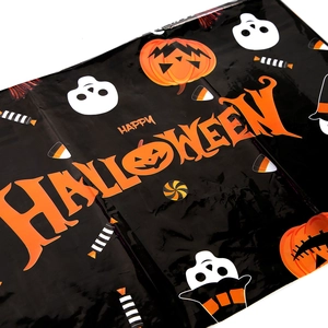 Detail of disposable PE Halloween tablecloth with pumpkin, ghost and candy patterns