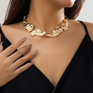 Irregular liquid lava texture choker necklace in gold finish for a bold avant-garde style