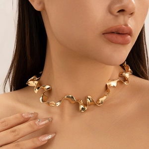 Minimalist gold liquid metal choker necklace featuring an irregular twisted wave design