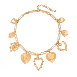 Gold multi-charm heart pendant necklace with various textured heart shapes on flat links