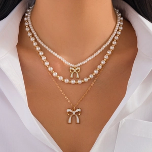 Collana A Strati Künstliche Perle Sintetiche Pendente Fiocco Smalto Bianco Tono Oro Elegante Chic Gioielli Per Donne Ragazze