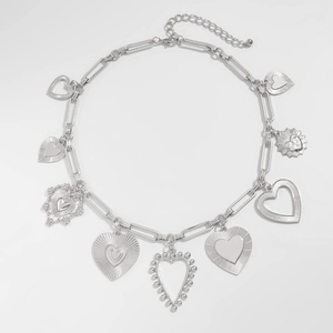 Silver paperclip chain necklace with various heart-shaped charms and toggle clasp detail
