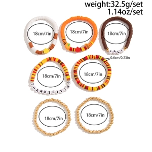 Detail of 7-piece Thanksgiving clay bead bracelet set with Fall leaf and pumpkin charms