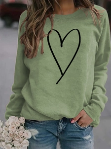 Detail of sage green long sleeve sweatshirt with heart outline and classic crew neck