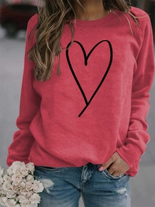 Detail of red crew neck sweatshirt with minimalist black line heart print on front