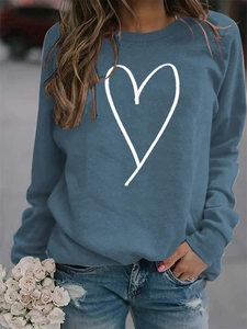 Detail of greyish blue crewneck sweatshirt featuring white line heart print design