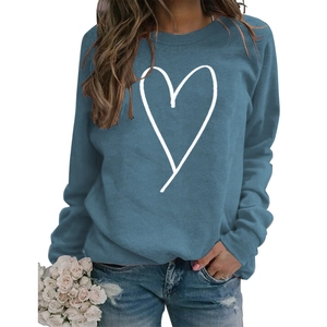 Detail of blue crewneck sweatshirt featuring a minimalist white line art heart pattern
