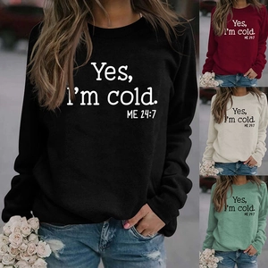 Detail view of cotton blend sweatshirt featuring Yes I am cold slogan print in four colors