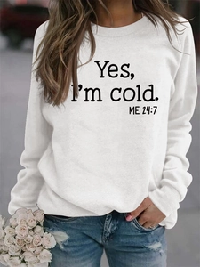 Detail shot of the black Yes I'm Cold slogan print on a white casual cotton sweatshirt