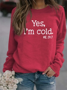 Close-up of red crewneck sweatshirt with white Yes I'm Cold 24:7 slogan print