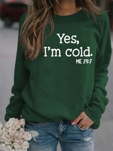 Detail of dark green sweatshirt with white Yes I'm Cold 24:7 print and knit texture