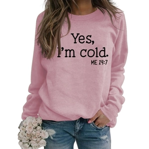 Close-up of the 'Yes I'm cold' slogan print on pink crewneck long sleeve sweatshirt