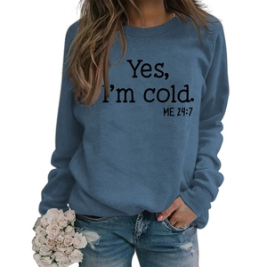 Close-up of Yes I'm Cold slogan print on blue crewneck sweatshirt for women