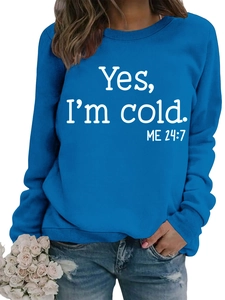 Detail of blue crewneck sweatshirt featuring white Yes I'm cold ME 24:7 printed text