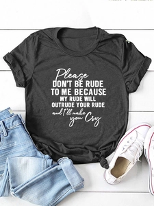 Flat lay of a charcoal gray slogan t-shirt with knotted hem and denim jeans outfit