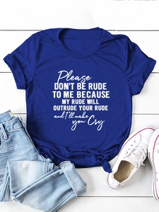 Flat lay of navy blue cotton t-shirt with white slogan and distressed blue jeans