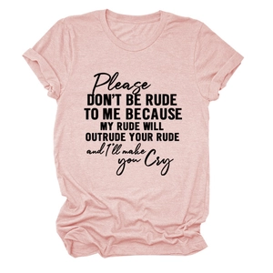 Close-up of heather pink cotton fabric with a bold black slogan print on the t-shirt