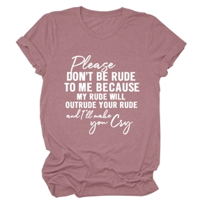Close-up of soft cotton pink t-shirt with Please Don't Be Rude white graphic slogan