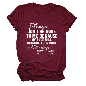 Detail of burgundy T-shirt featuring white Please Don't Be Rude text on cotton fabric