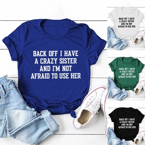 Detail showing blue, white, green and black cotton t-shirts with stylish front knot design
