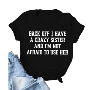Classic black cotton crewneck T-shirt with white graphic slogan and blue denim jeans