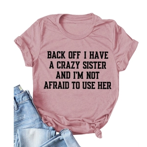 Pink crew neck t-shirt with bold letter print and side knot detail for a casual look
