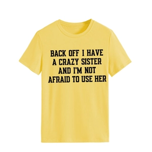 Detailed view of yellow cotton t-shirt with black bold humorous letter printing